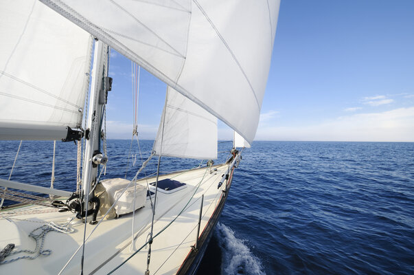 Sailing towards the horizon on a sunny day